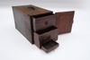 A rare Japanese rectangular portable wooden box with four drawers of various size behind a door