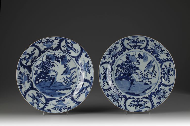 A pair of large blue and white plates