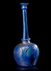 A LARGE MOULD-BLOWN BLUE GLASS BOTTLE-VASE OR SPRINKLER, PERSIA, 12TH CENTURY
