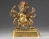 A Tibetan gilt bronze six-armed Mahakala