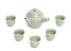 A Japanese Nabeshima-ware celadon sencha-tea set consisting of a tea pot (kyūsu)  with a perpendicular handle (yokote)