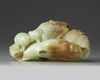 A large Chinese celadon and russet jade ‘lotus and gold fish’ carving