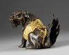 A Chinese parcel-gilt bronze Buddhist lion