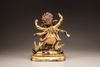 A Sino-Tibetan gilt-bronze six-armed Mahakala