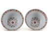 A PAIR OF SGRAFFITO RUBY-GROUND FAMILLE ROSE 'MEDALLION' BOWLS