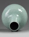 A CHINESE CARVED AND MOULDED CELADON-GLAZED BOTTLE VASE