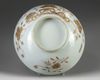 A Chinese iron-red and gilt-decorated moulded bowl