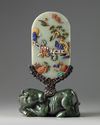 A Chinese hardstone-inlaid celadon jade table screen on a wood and spinach jade stand