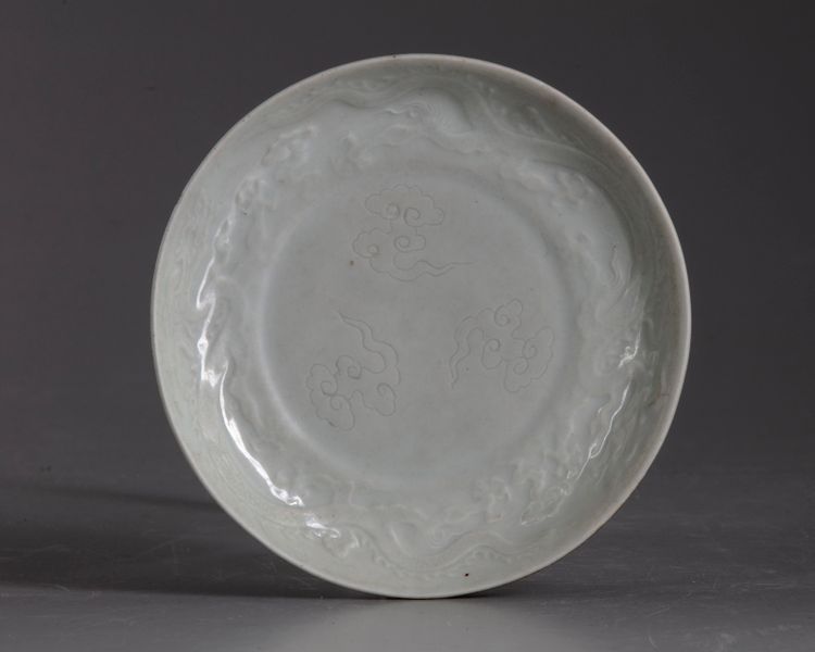 A Chinese café-au-lait glazed anhua decorated dragon dish