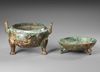 A CHINESE BRONZE TRIPOD STORAGE VESSEL AND AN ASSOCIATED COVER, MING DYNASTY (1368-1644)
