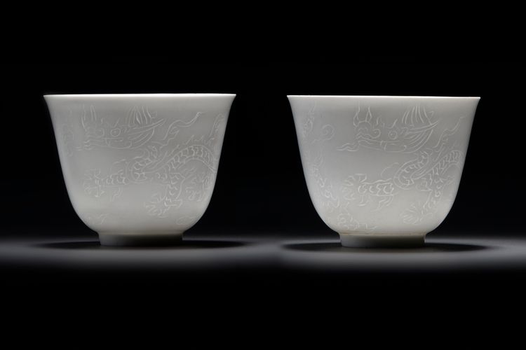 A  PAIR OF SMALL CHINESE WHITE-GLAZED DRAGONS CUPS, 20TH CENTURY