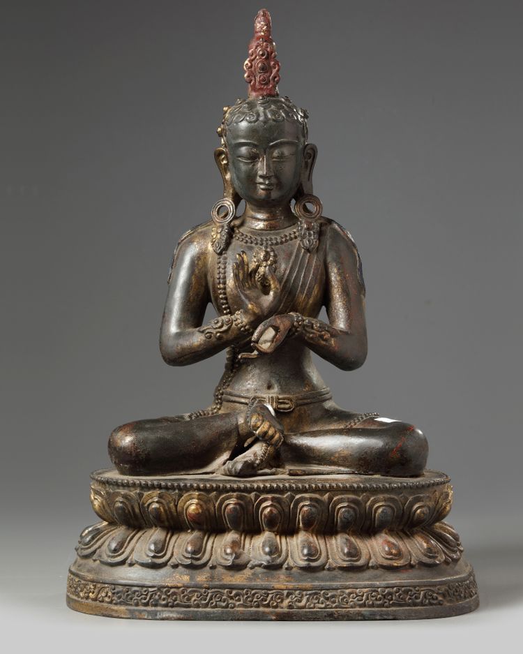 A gilt Chinese figure of a buddha