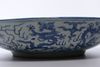 A LARGE CHINESE BLUE AND WHITE DRAGONS DISH, MING DYNASTY (1368-1644) OR LATER
