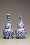 A pair of blue and white double gourd vases