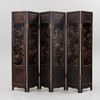 A Chinese precious objects-inlaid black lacquer carved wood six-fold screen