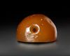 A SASSANIAN AGATE DOMED SEAL OF A CROUCHING LION, CIRCA 5TH CENTURY A.D.