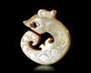 A YELLOWISH-GREEN JADE DRAGON, CHINA, SHANG DYNASTY