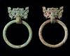 A pair of Chinese bronze taotie mask fittings with loose-ring handles
