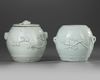 TWO CHINESE BLANC DE CHINE BARREL SHAPED JARS AND A COVER, 18TH CENTURY