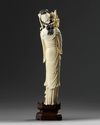 A Chinese ivory carving of a lady holding a flower basket