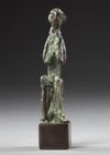 A WESTERN ASIATIC BRONZE SEATED FIGURE, CIRCA 2ND MILLENNIUM  B.C.