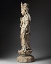 A LARGE CHINESE POLYCHROME-DECORATED WOOD CARVING OF GUANYIN, POSSIBLY SONG-YUAN DYNASTY