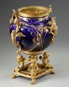 A FRENCH GILT SPELTER AND BLUE PORCELAIN FLOWER POT,  LATE 19TH CENTURY