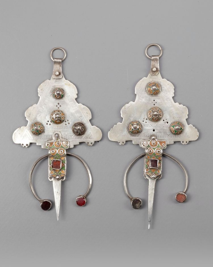 A pair of silver fibula with mineral stone inlay