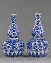 TWO CHINESE BLUE AND WHITE DOUBLE-GOURD VASES