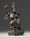 A Tibetan bronze figure of Vajrapani with stand