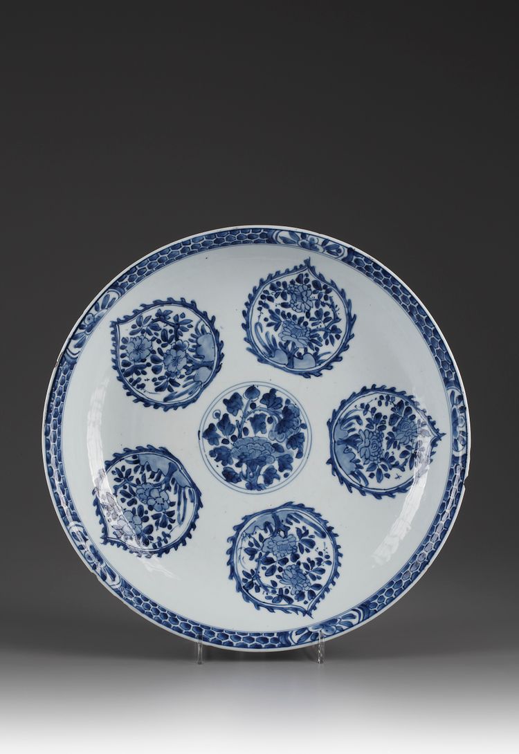 A blue and white charger