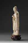 A Chinese ivory carving of a standing immortal