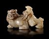 A CHINESE JADE OF AN IMMORTAL RIDING A BIXIE,  HAN DYNASTY (206 BC–220 AD)
