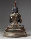 A gilt Chinese figure of a buddha