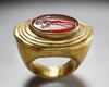 A GREEK GOLD AND CARNELIAN FINGER RING WITH CUPID, HELLENISTIC PERIOD, CIRCA 2ND-1ST CENTURY B.C.
