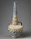 A TWO-HANDLED GLASS FLASK, CIRCA 12TH CENTURY