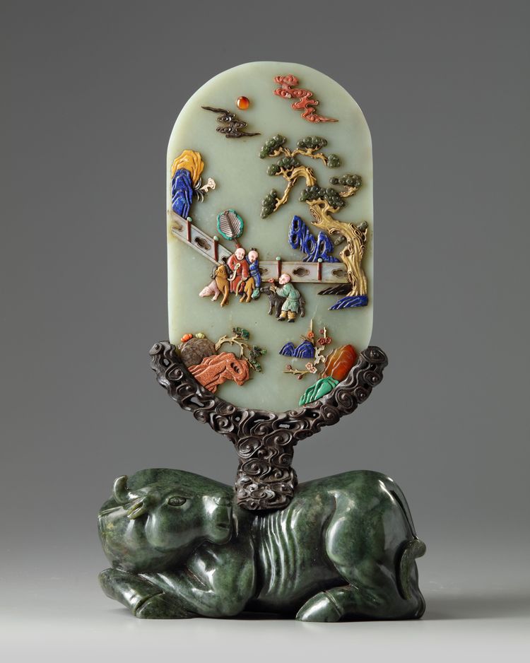 A Chinese hardstone-inlaid celadon jade table screen on a wood and spinach jade stand