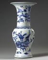 A Chinese blue and white 'precious objects' phoenix tail vase