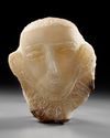 A CARVED ALABASTER FUNERARY PORTRAIT WITH INSCRIPTION TO THE NECK, LATE 1ST MILLENNIUM BC