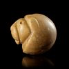 A NEAR EASTERN STAMP SEAL IN THE FORM OF A LION'S HEAD IN YELLOW CALCITE. 3rd. mil.B.C.