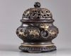 A Chinese parcel-gilt bronze 'sea creatures' censer, cover, and stand
