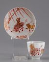 A gilt Chinese cup and saucer