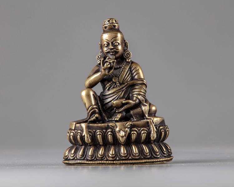 A bronze seated figure