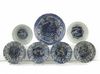 A group of seven Chinese blue and white moulded ‘Kraak porselein’ small bowls