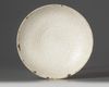 A Chinese white-glazed Dingyao moulded bowl
