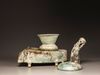 A CHINESE GREEN-GLAZED POTTERY STOVE WITH A DRAGON CHIMNEY