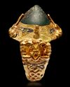 A GREEN STONE SET GOLD RING