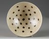 A CHINESE CREAM-GLAZED SPOTTED BOWL, QING DYNASTY (1644 - 1911)