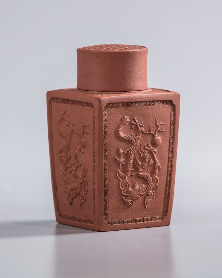 A Chinese yixing 'dragon' square-section tea caddy and cover