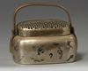 A Chinese brass 'narrative' hand warmer